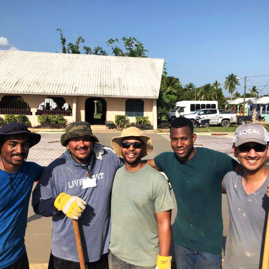 A group of men standing outside during a mission to Belize.
